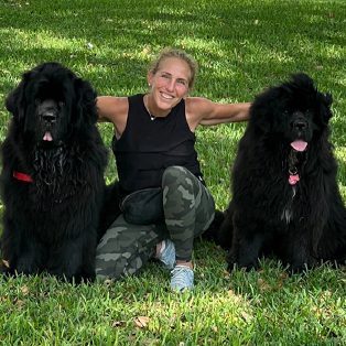 Jill with two black dogs
