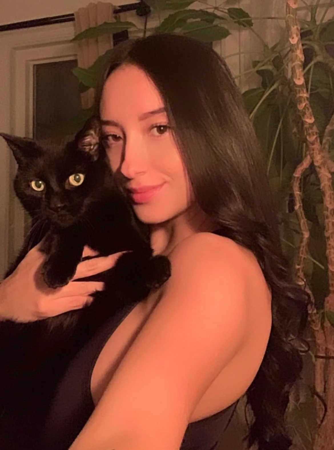 maria holding a black cat