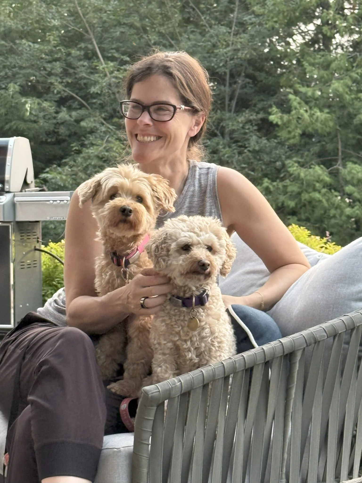 penny sitting with a dog